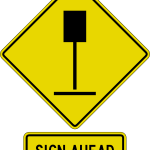 Warning sign advising, "sign ahead".